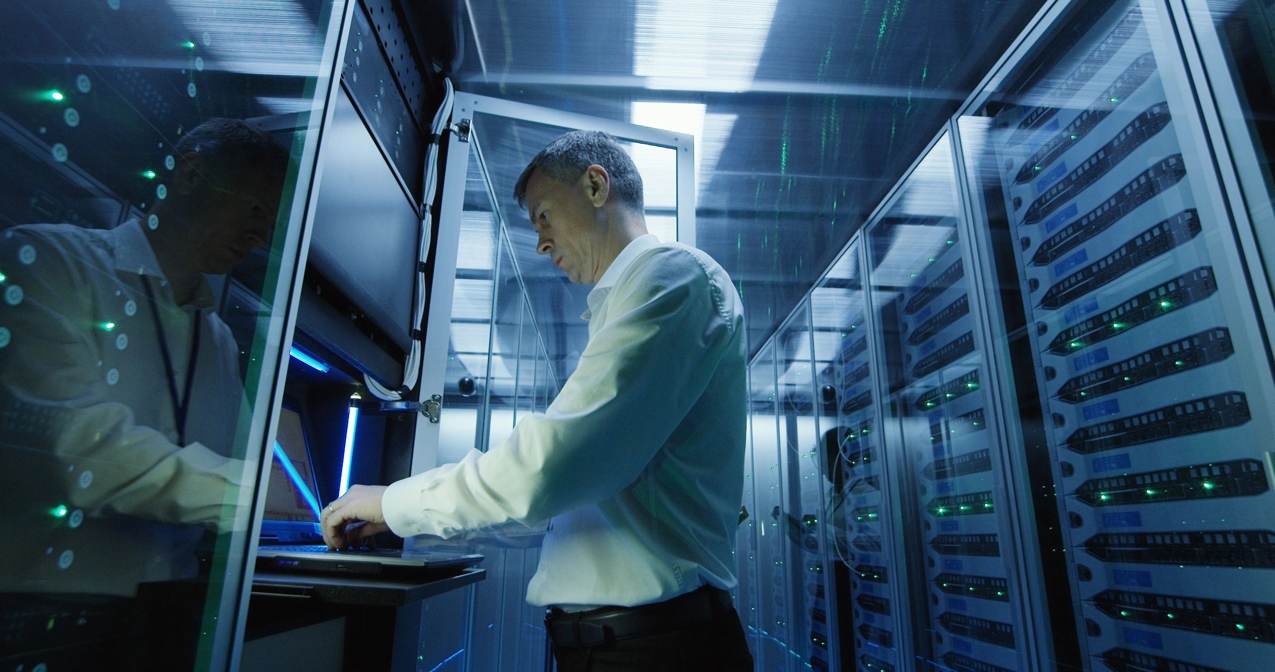 Professional using a laptop for technical work